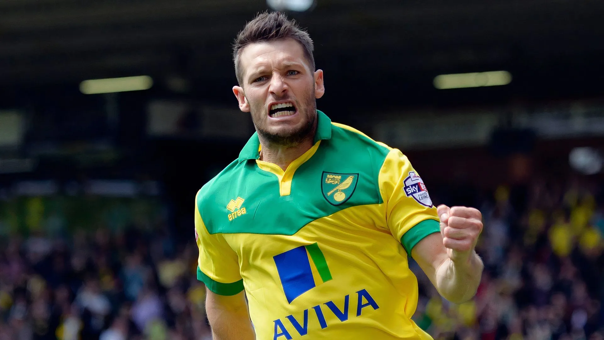 Wes Hoolahan đang kiểm soát bóng trên sân cỏ, biểu tượng của sự sáng tạo